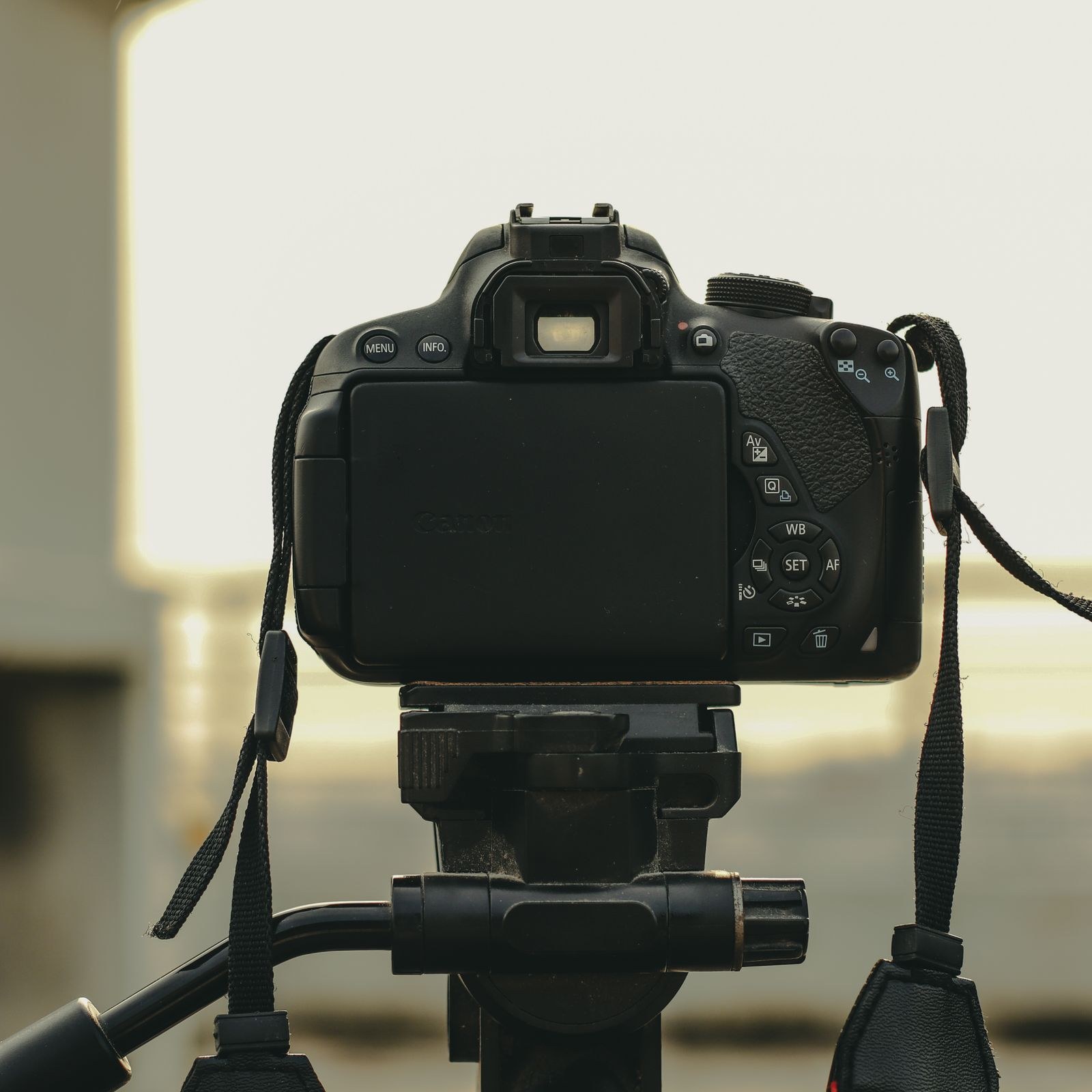 Editor framing a shot with a camera on location